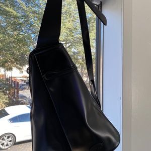 Sling style black leather